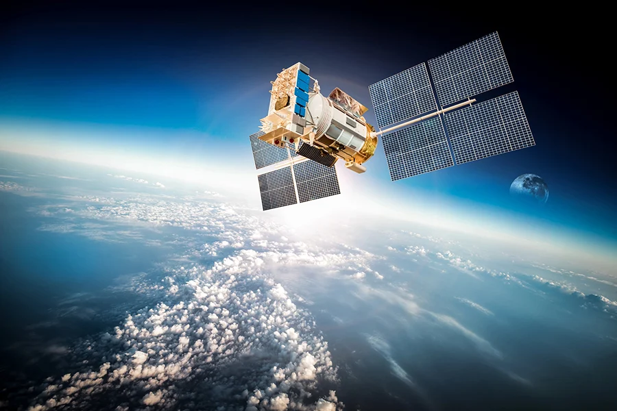 A Satellite Orbiting Earth With Solar Panels Extended, Symbolizing Satellite Radio Advertising Technology In Space a satellite orbiting earth with solar panels extended, symbolizing satellite radio advertising technology in space