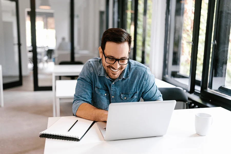 Adult-Man-Looking-At-Ads-Online-Due-To-A-Successful-Ad-Copy-That-Targets-Audiences. adult man looking at ads online due to a successful ad copy that targets audiences.