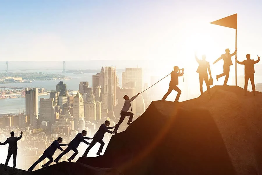 Business Men Climbing The Mountain Top Concept Image For Challenges With Marketing A Franchise business men climbing the mountain top concept image for challenges with marketing a franchise