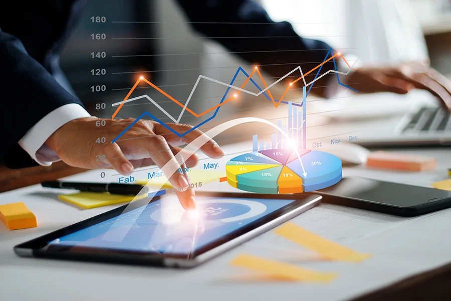 Businessman Analyzing Drtv Numbers Using A Laptop And Tablet businessman analyzing drtv numbers using a laptop and tablet