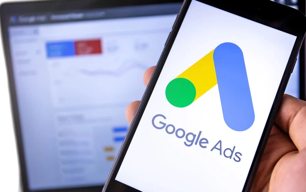Smartphone With Google Ads On The Screen And Display Notebook Ba google ads for concierge doctors graphic