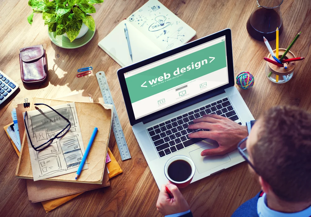 guy working on a website design project on his laptop
