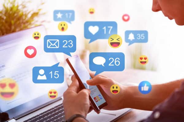 Employee engaging on social media concept image for franchise locations using social media marketing within their target market for new customers