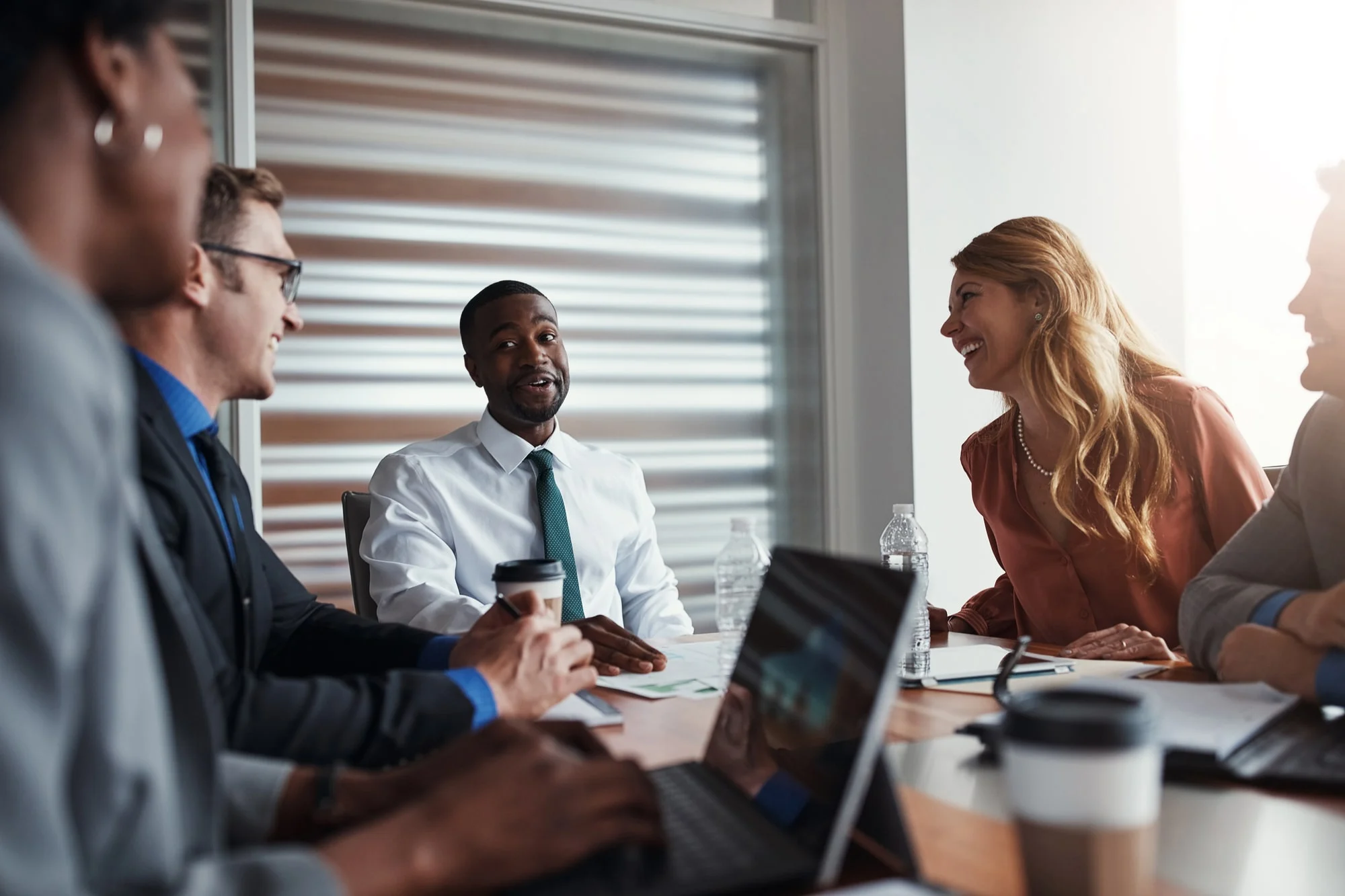 If We Put Our Minds Together, We Can Greatly Transform Business. A Group Of Businesspeople Having A Meeting In An Office. seo white label partner