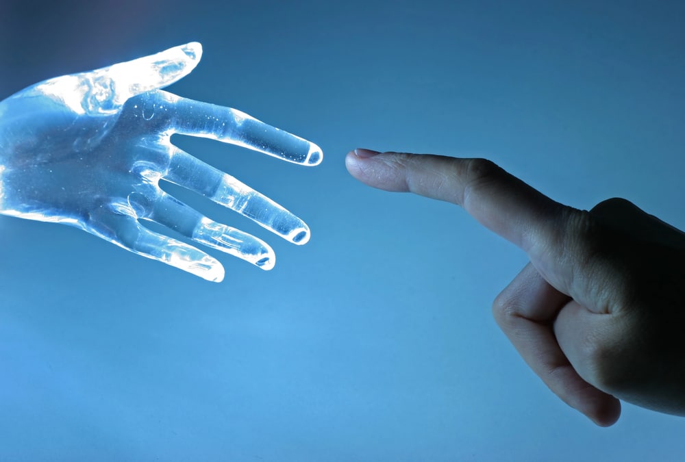 ai and human hand touching