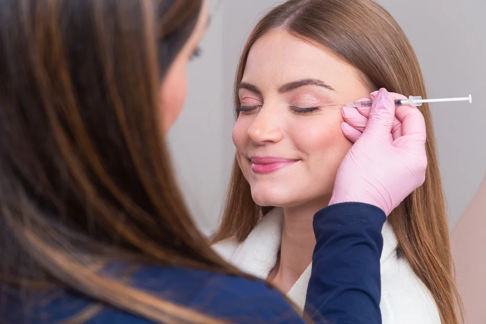 Woman Wearing Bathrobe In Beauty Clinic, Aesthetics, Patient, Co a female patient who booked a botox appointment from google ads for medspas