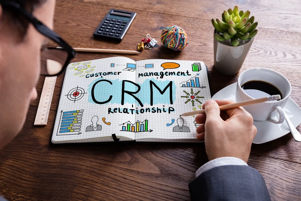Businessperson Drawing Customer Relationship Concept On Notebook crm