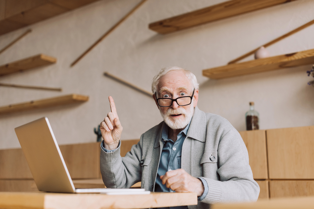 old man looking at a senior living industry website