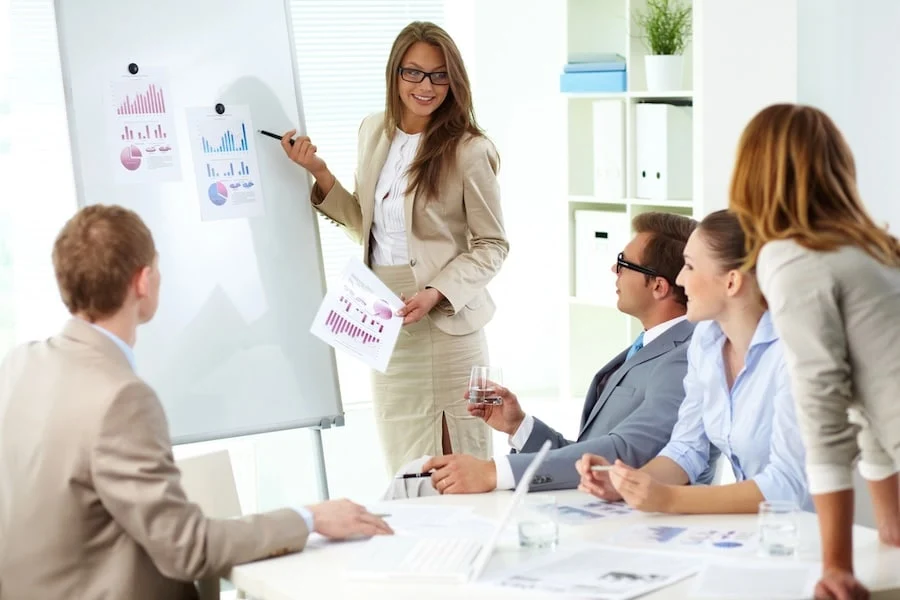 female employee giving an seo and analytics presentation to her team
