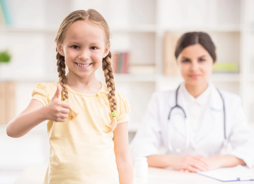 Happy-Girl-At-Pediatrician digital presence for pediatric practices led to a new patient