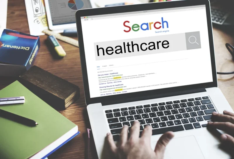 person using laptop to do a search for a healthcare business