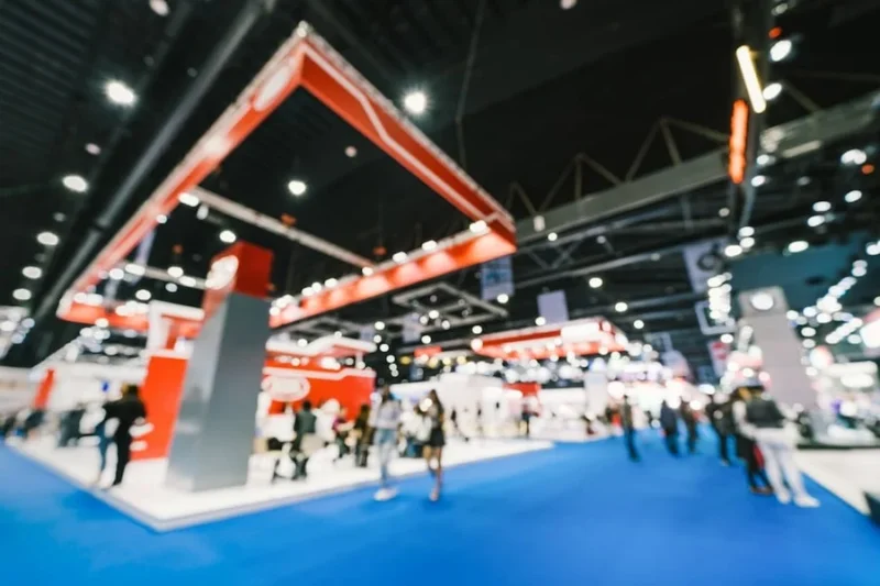 How To Choose A Franchise Marketing Agency 2 a bustling expo floor filled with franchise industry professionals networking and exploring new business opportunities. many of them are asking around